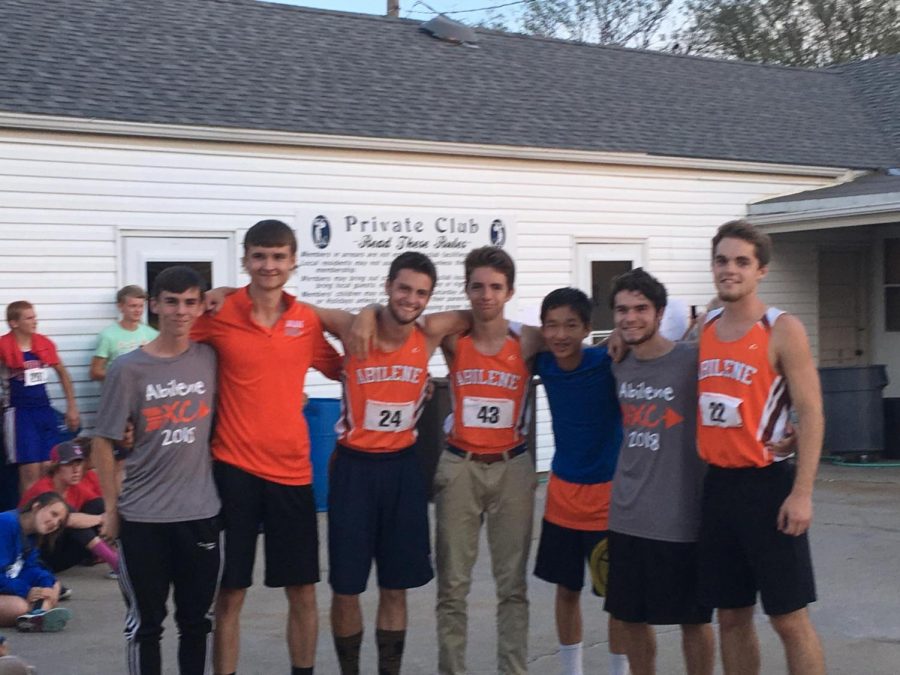 Triston (far left) with the rest of the varsity cross country team following a meet in 2018.