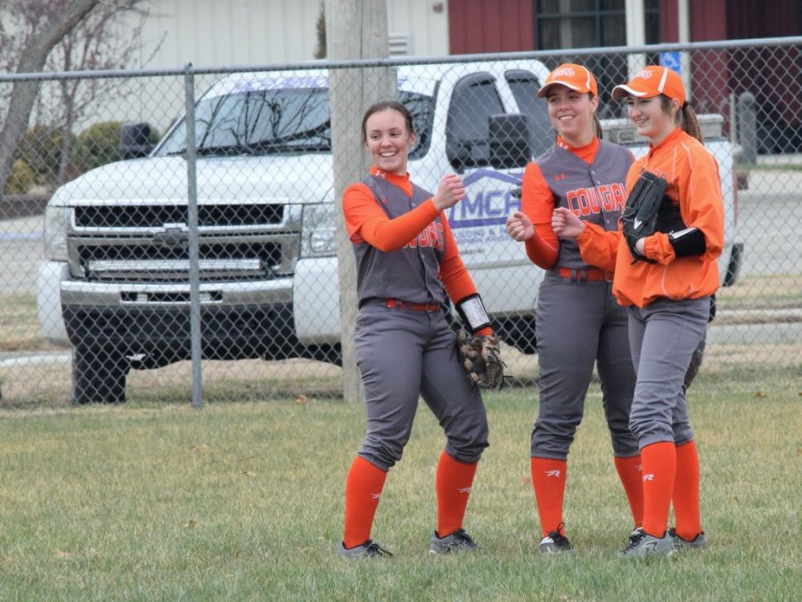 Jade, left, with Rylie Volkman and Kayley Taylor, during a softball scrimmage. 