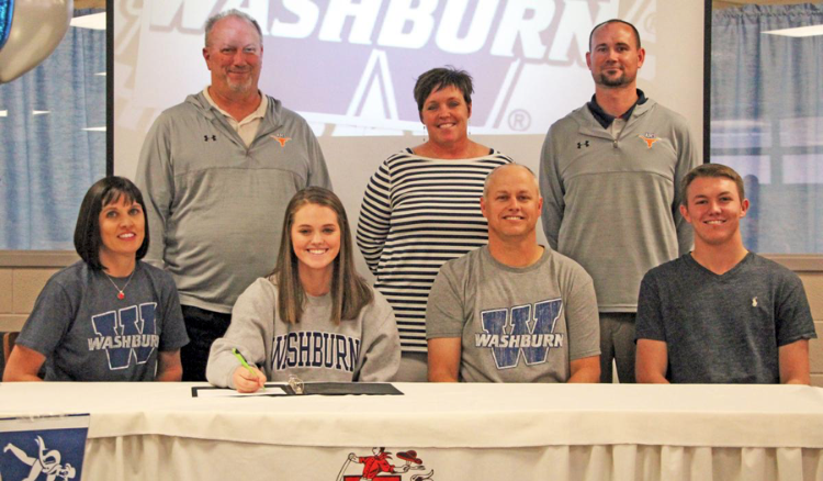 Willey at her signing to Washburn. Staggered from left to right are; Renae Willey, Mike Liby, Hannah Willey, Molly Burton, Mark Willey, Tyler Bryson, and Marcus Willey. 