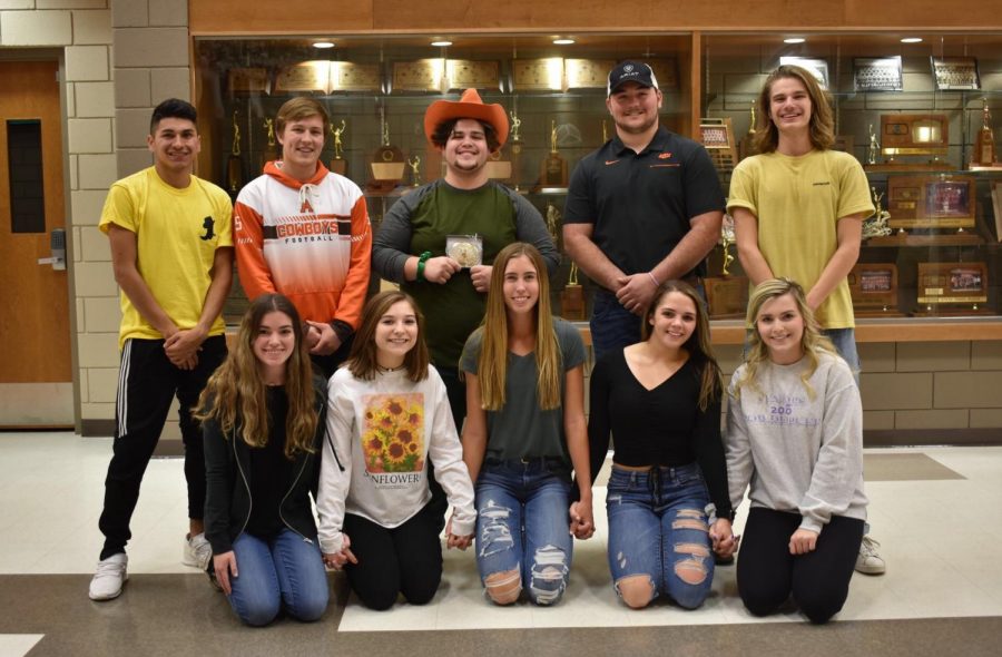 Cowboy Joe winner Adam Henely poses with fellow candidates Christian Radabaugh, Jackson Randles, Kade Funston, and Josh Young, with campaign managers Taylor Heitschmidt, Aly Johnson, Shiann Olberding, Savannah Stout, and Anna Zey.