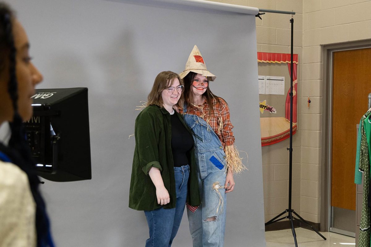 Musical Director of "Wizard of Oz," Harlie Delay, AHS Class of 2019, poses for media photos with her younger sister, sophomore Kenlie Delay.  Harlie is directing the AHS Musical for the first time while her sister will be playing the part of Scarecrow in the show which runs this week at the AHS auditorium.